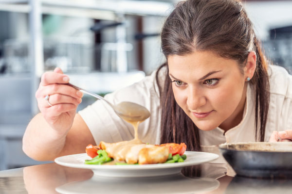 Experienced private chef preparing gourmet meals in a Atherton home, provided by Aunt Ann’s In-House Staffing.